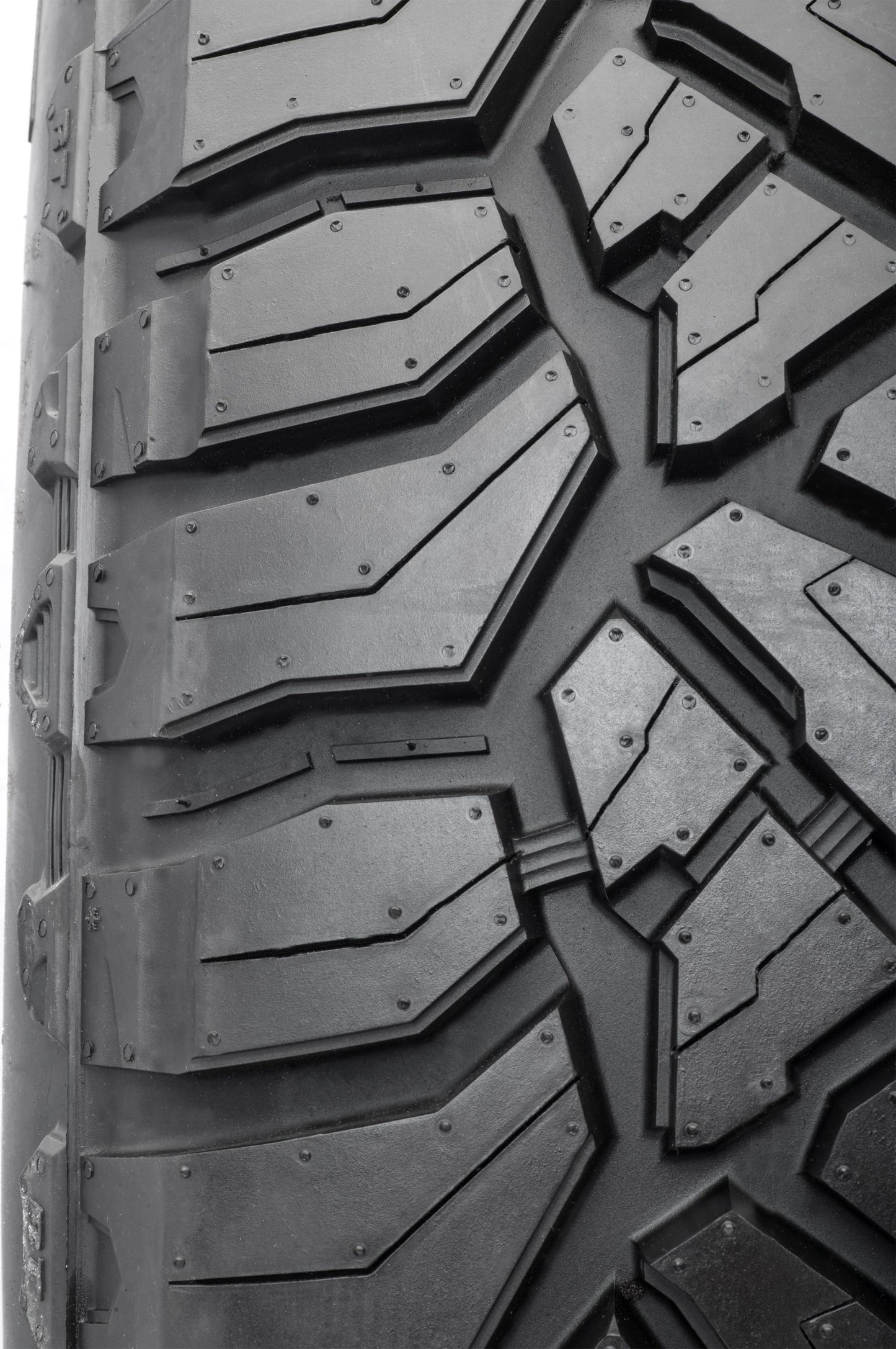 Zoomed Terramax RT tread pattern with stone ejectors and siping